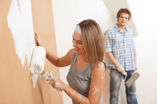picture of people priming and painting walls