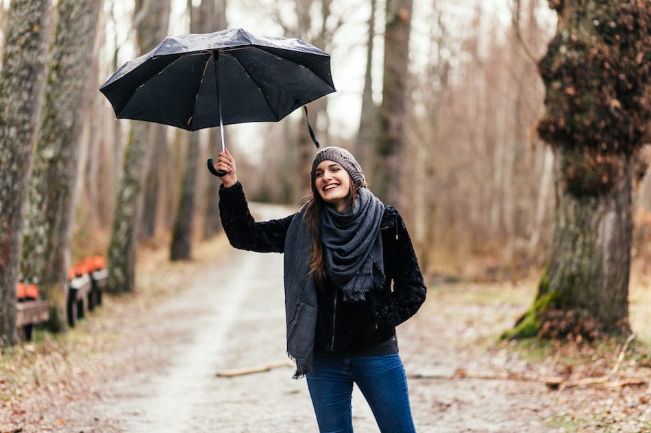 picture of a woman enjoying the rain