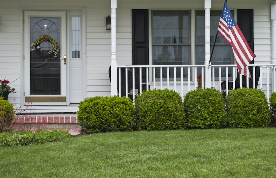 picture of a front porch with an american flag