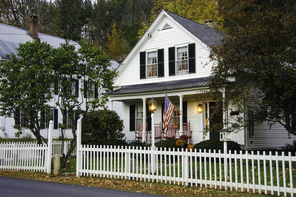 picture of White clapboard house with a white picket fence