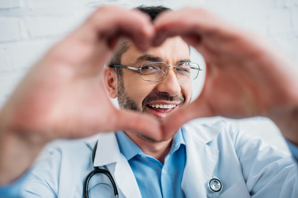 picture of a Rhode Island medical professional making a heart with hands