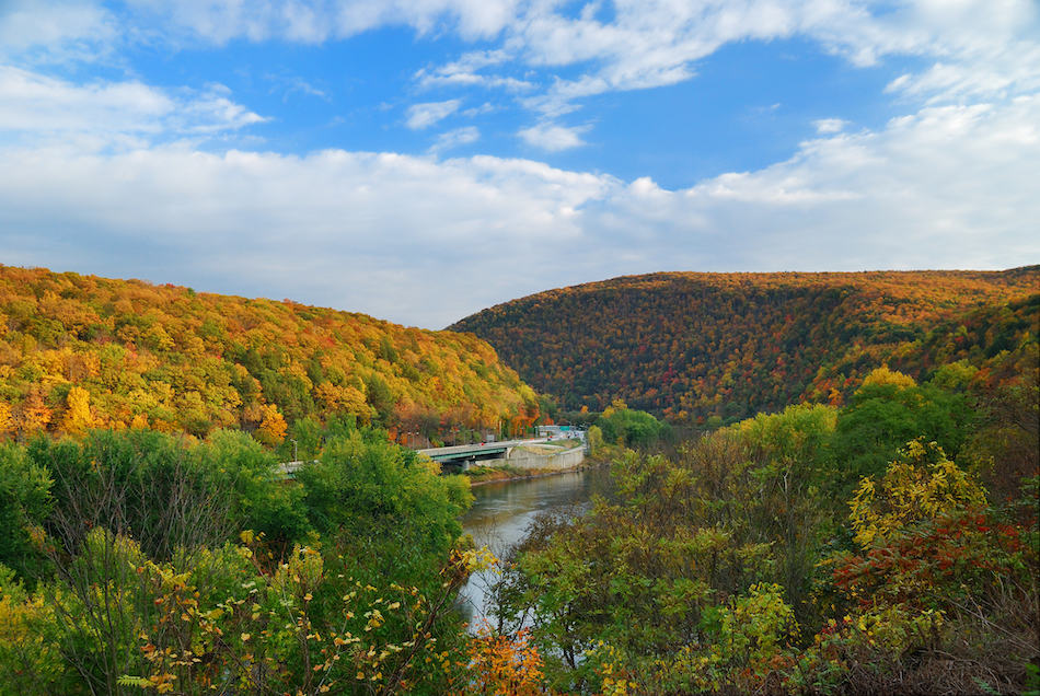 Delaware Water Gap panorama in Autumn with colorful foliage with forest and mountain over river.