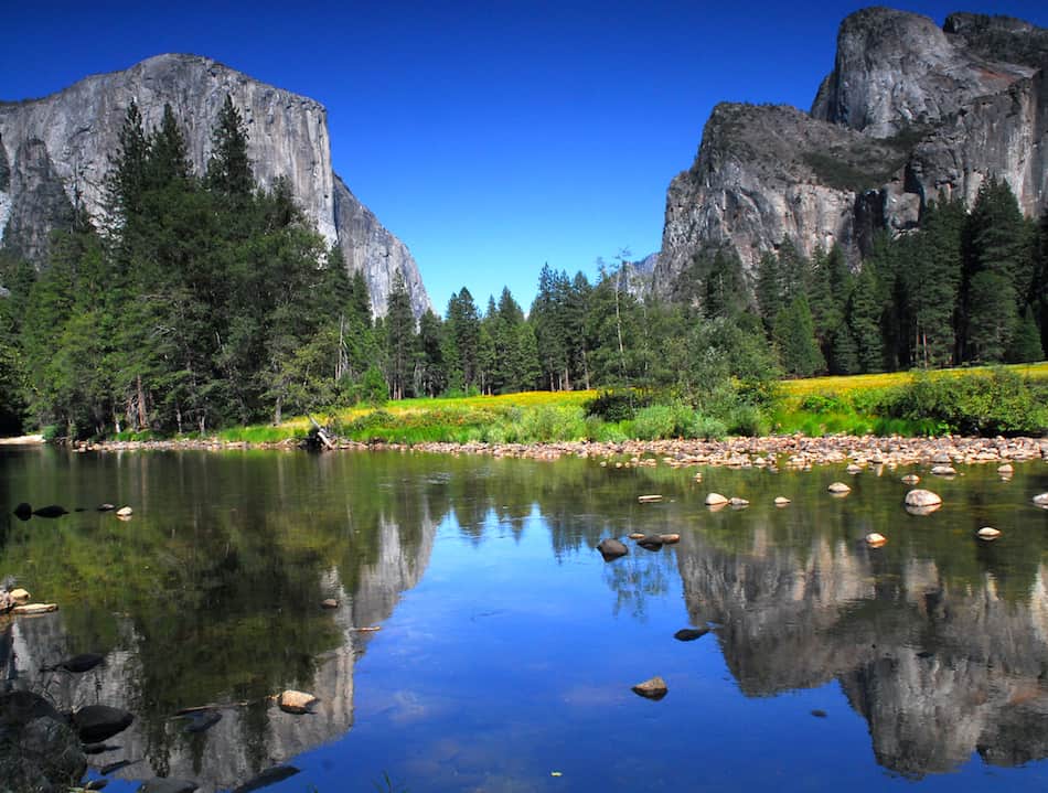 Summertime view of El Capitan in Yosemite National Park from the Merced River