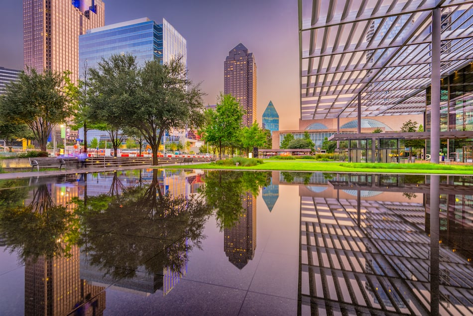 Dallas, Texas, USA downtown plaza and cityscape at twilight.