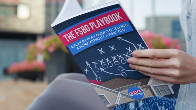 picture of a woman reading our fsbo playbook